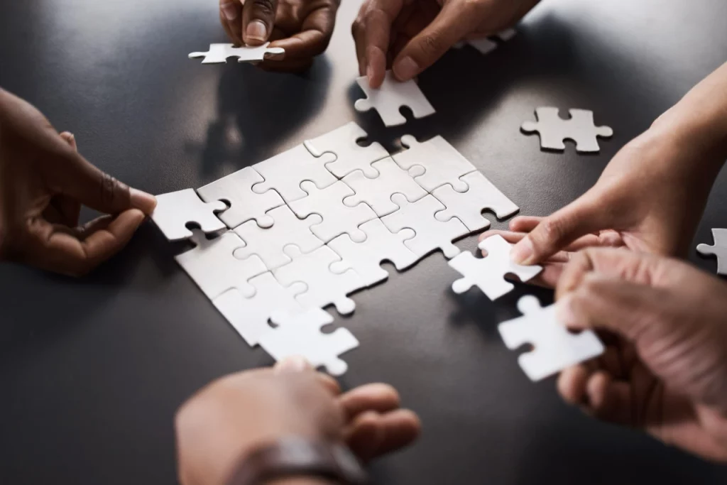 Multiple people solving the puzzle