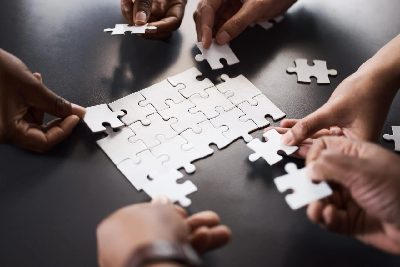 Multiple people solving the puzzle